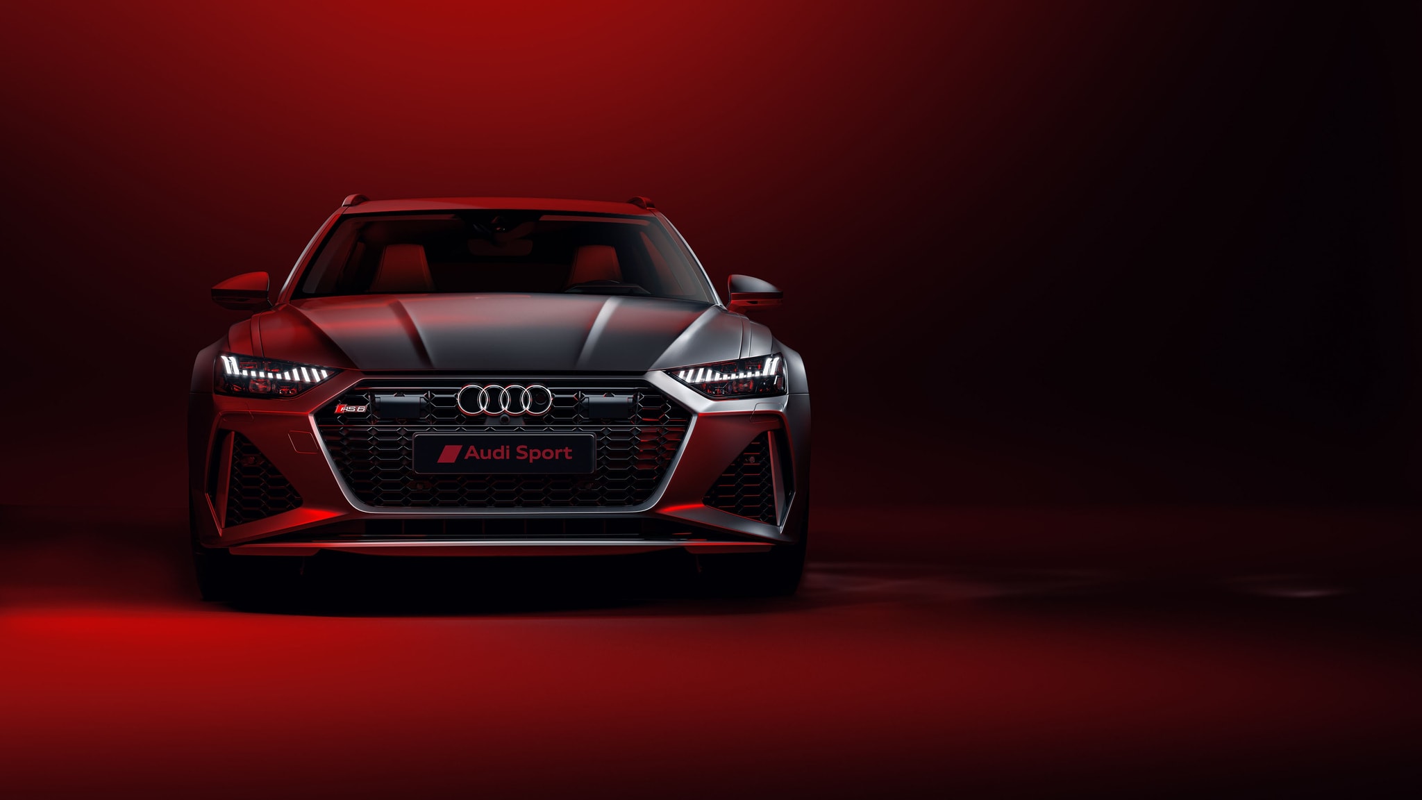 Audi RS6 tamno sivi na crvenoj pozadini